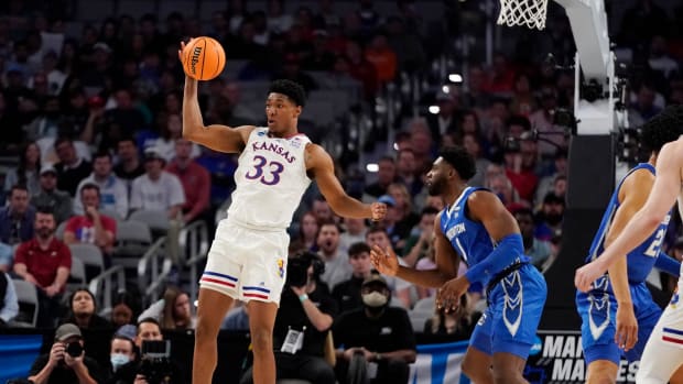 Mar 19, 2022; Fort Worth, TX, USA; Kansas Jayhawks forward David McCormack (33) backs in against Creighton Bluejays forward KeyShawn Feazell (1) during the second round of the 2022 NCAA Tournament at Dickies Arena. Mandatory Credit: Chris Jones-USA TODAY Sports